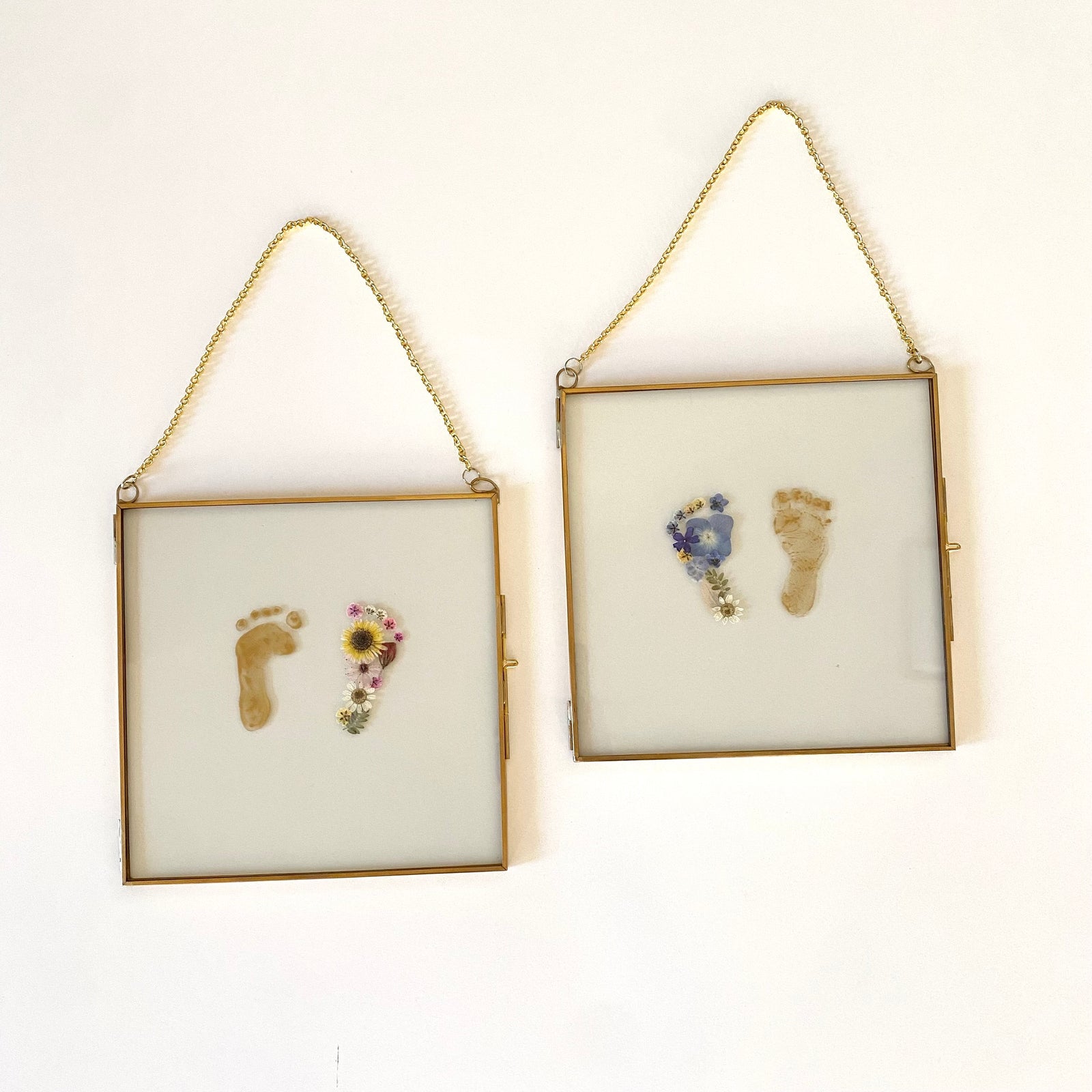 Framed baby footprints with pressed flowers