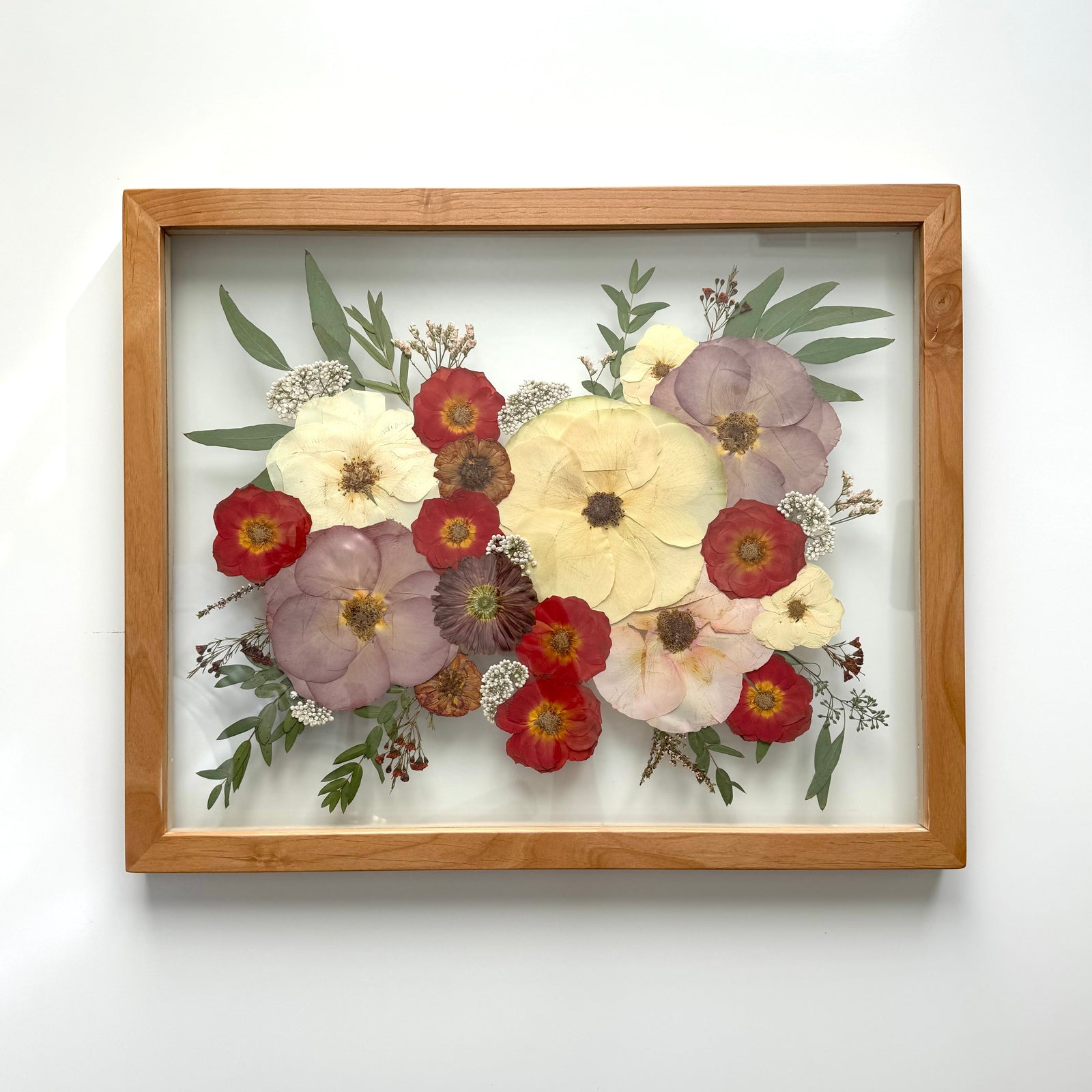 Pressed flowers in a 16x20 natural frame
