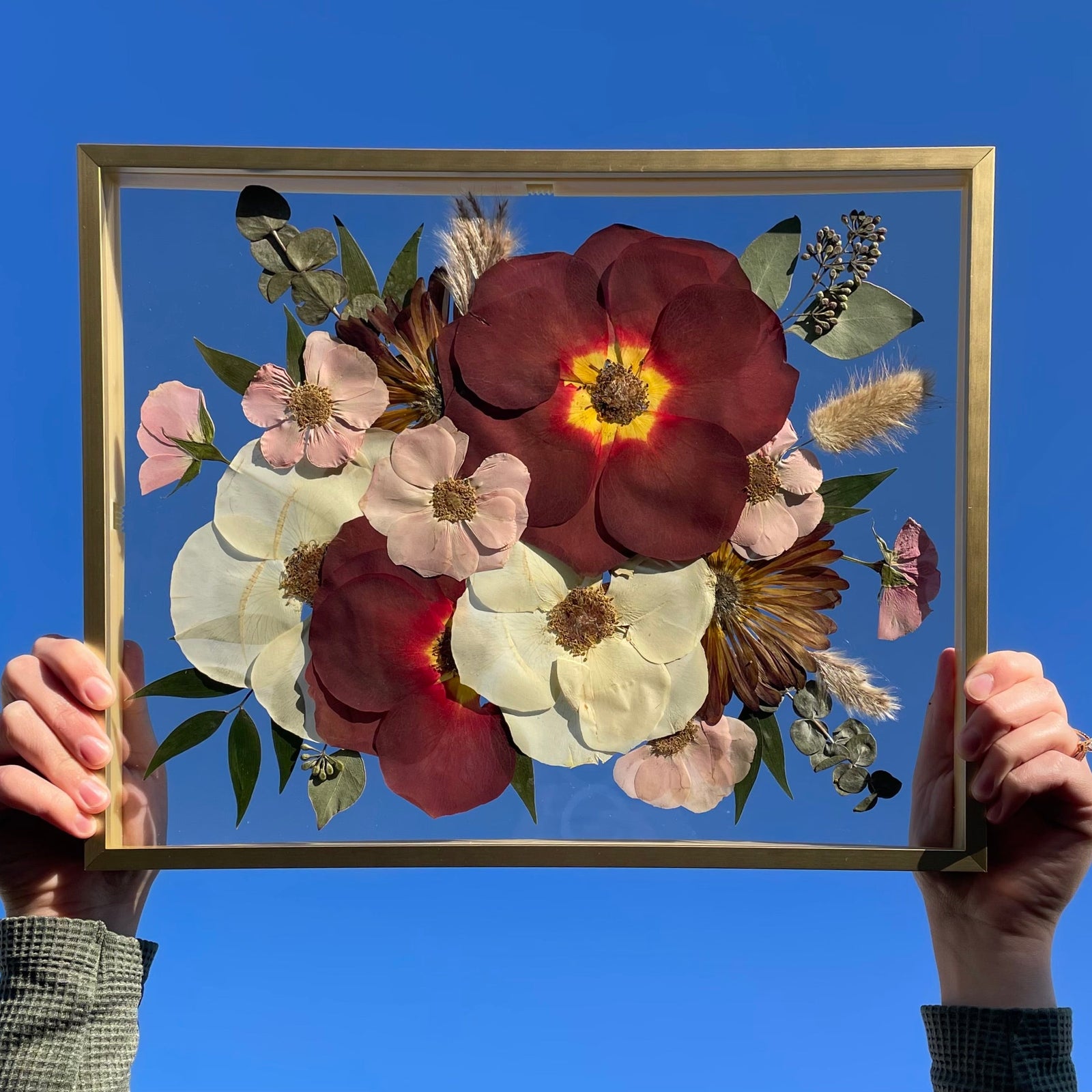 Pressed flowers in a 12x15 gold frame