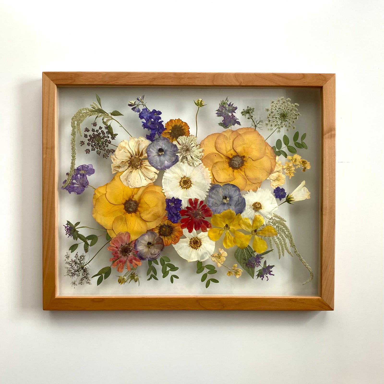 Pressed flowers in a 16x20 natural frame