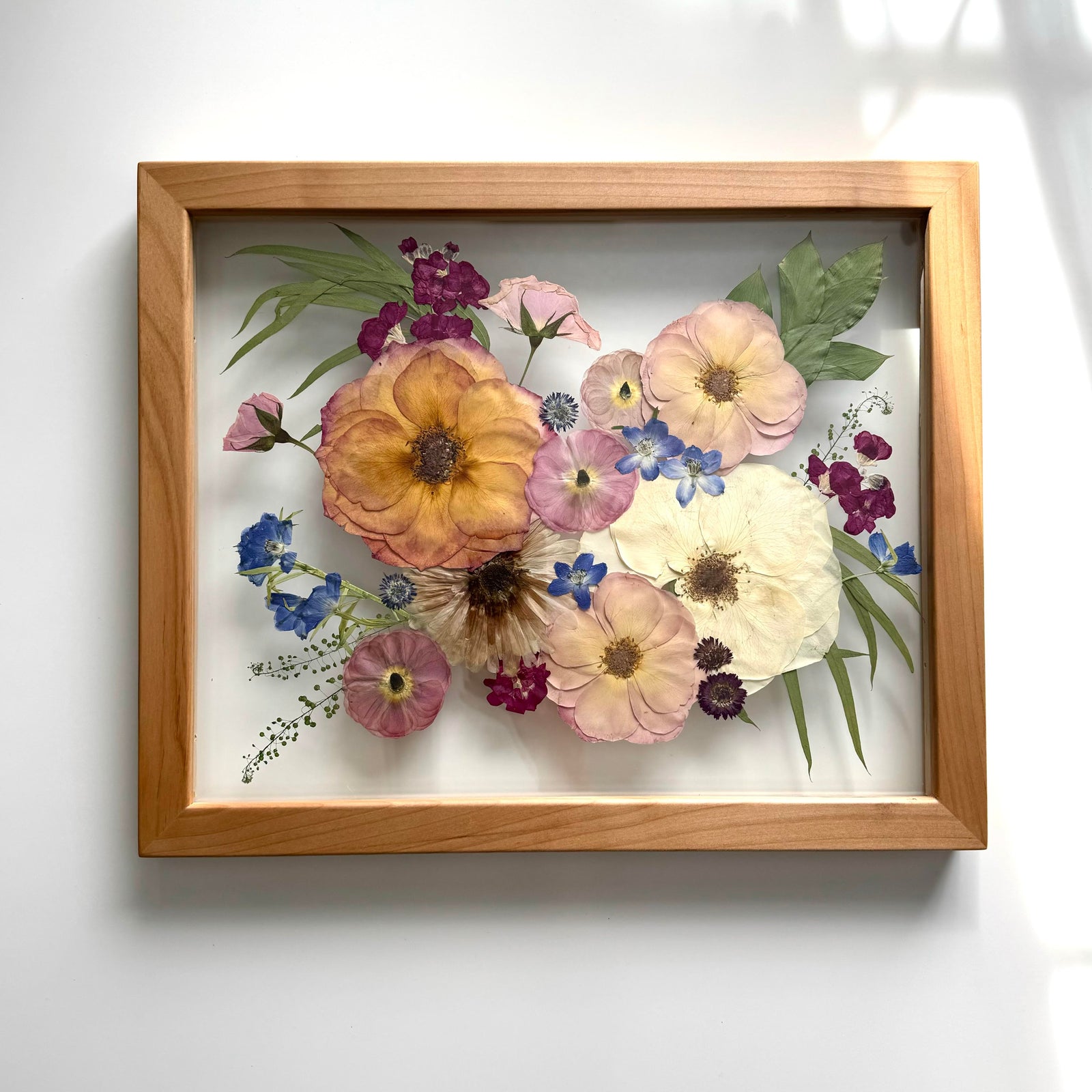 Pressed bouquet in a 12x15 natural frame